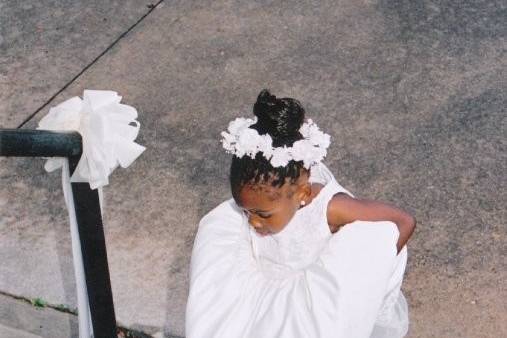 Flower girl walking up steps