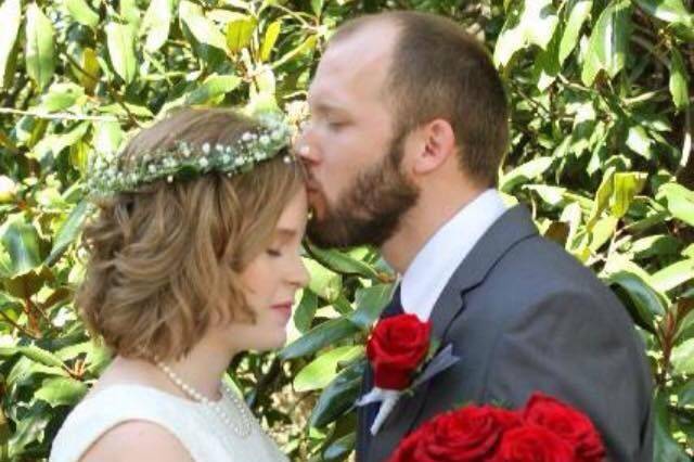 Groom kissing the bride