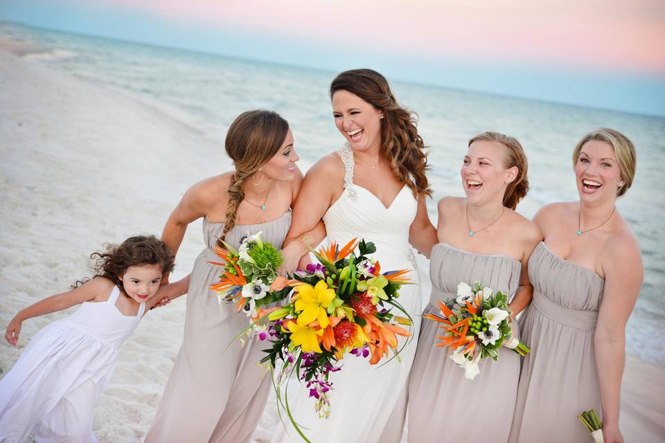 Bride and bridesmaids on the beach