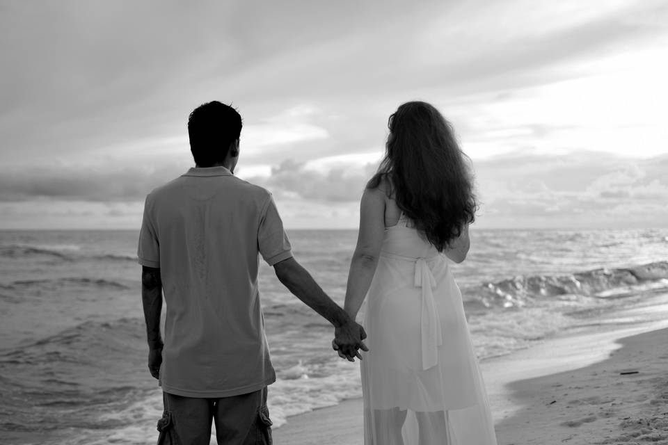 Newlyweds overlooking the beach