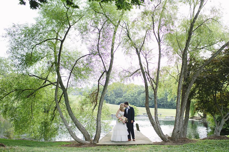 Couple beside a pond