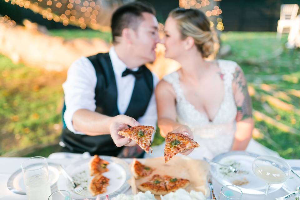 Newlyweds sharing pizza