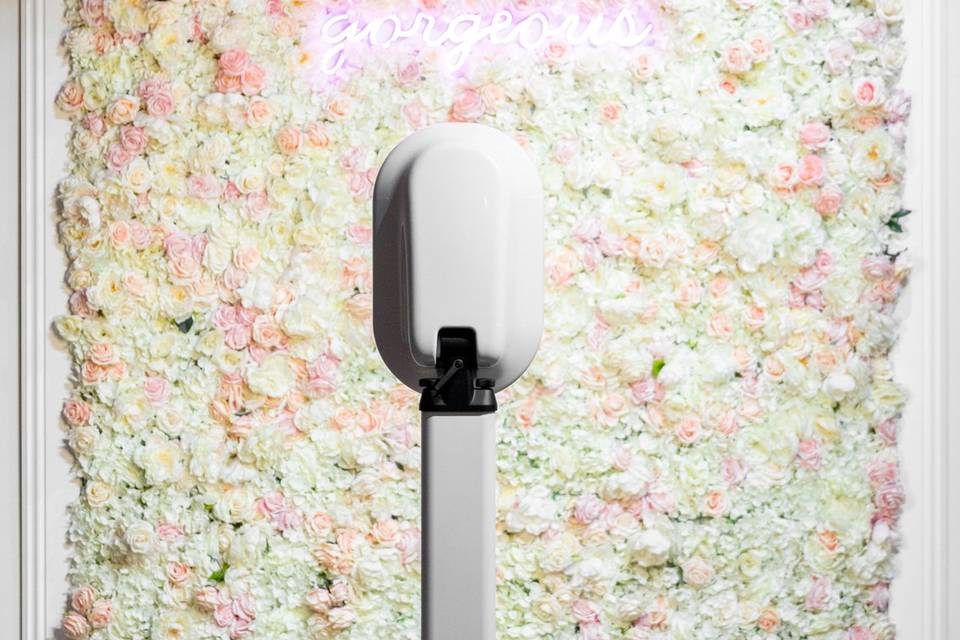 Flower wall backdrop and neon sign