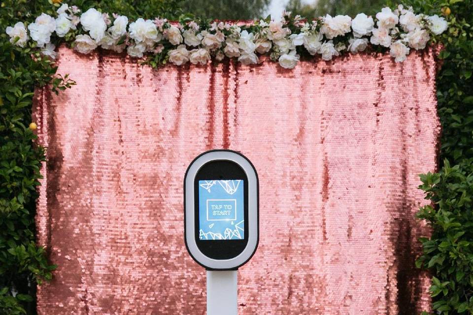 Pink sequin backdrop with flowers