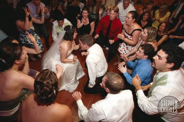 Dancing couple with guests