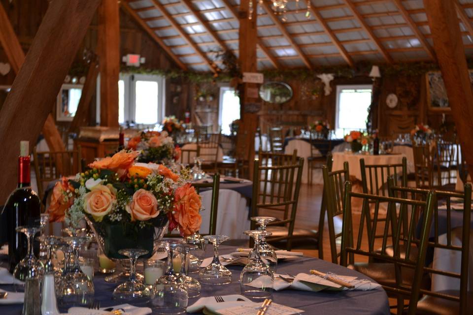 A view of the reception tables for this rustic elegance themed wedding reception