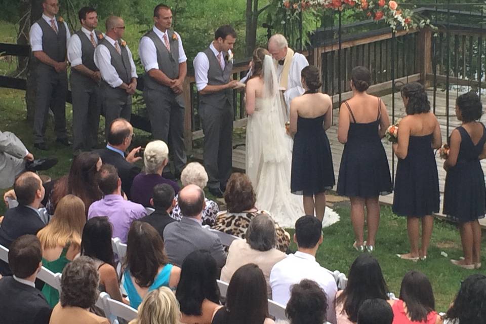 A view of the ceremony for this Rustic Elegance themed wedding