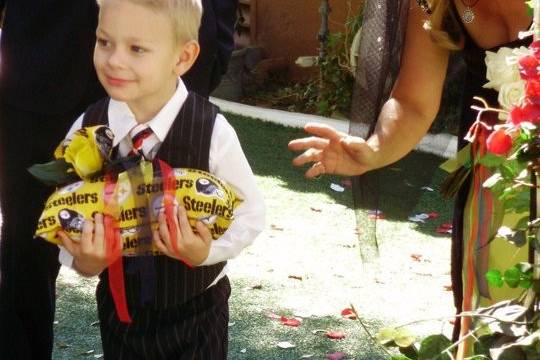 The cute ringer bearer had cold feet ans was coaxed down the aisle by the bride. Love this little guy. He was great.
