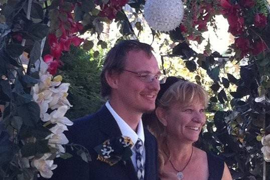 Preparing to walk down the aisle. Love this picture under the arbor.