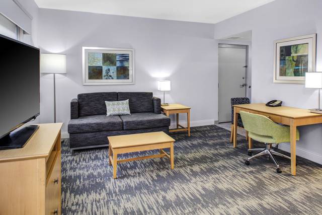 Living area of King Suite with sleeper sofa.