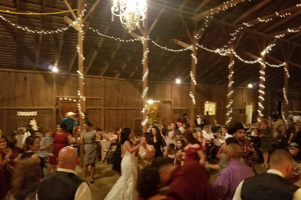 Guests dancing with the bride