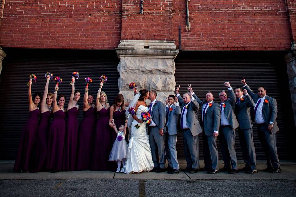 The couple with the bridesmaids and groomsmen