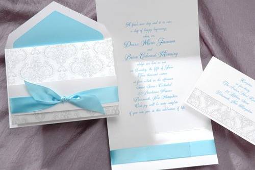 The scroll work on this bright white felt invitation is charming in a subtle shade of charcoal. A self-adhesive satin band is included. (T6531TR)