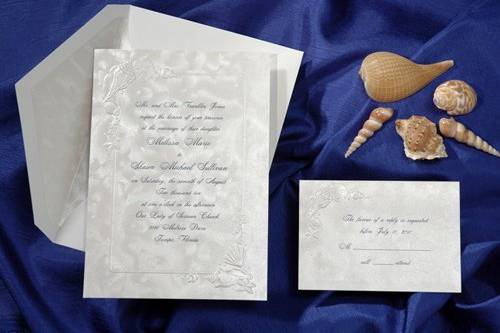 On European paper, this beautiful invitation has an embossed border decorated with gems of the ocean. (T8912)