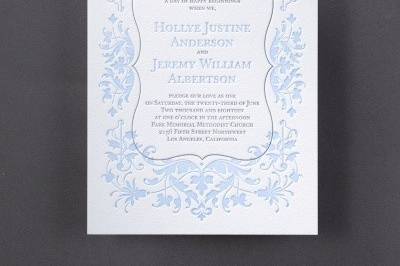 Extravagant Floral - Invitation: A crest-shaped frame and extravagant floral design surround your wording on this charming invitation.
Dimensions: 6