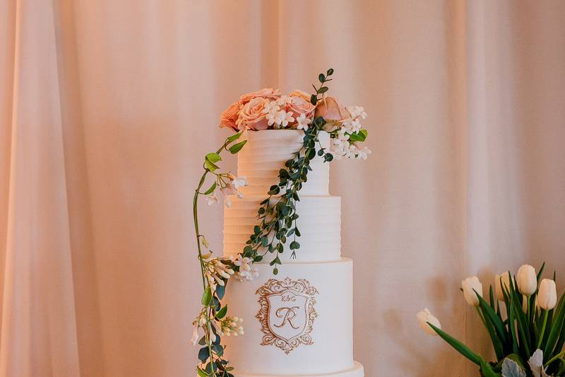 White wedding cake with white roses