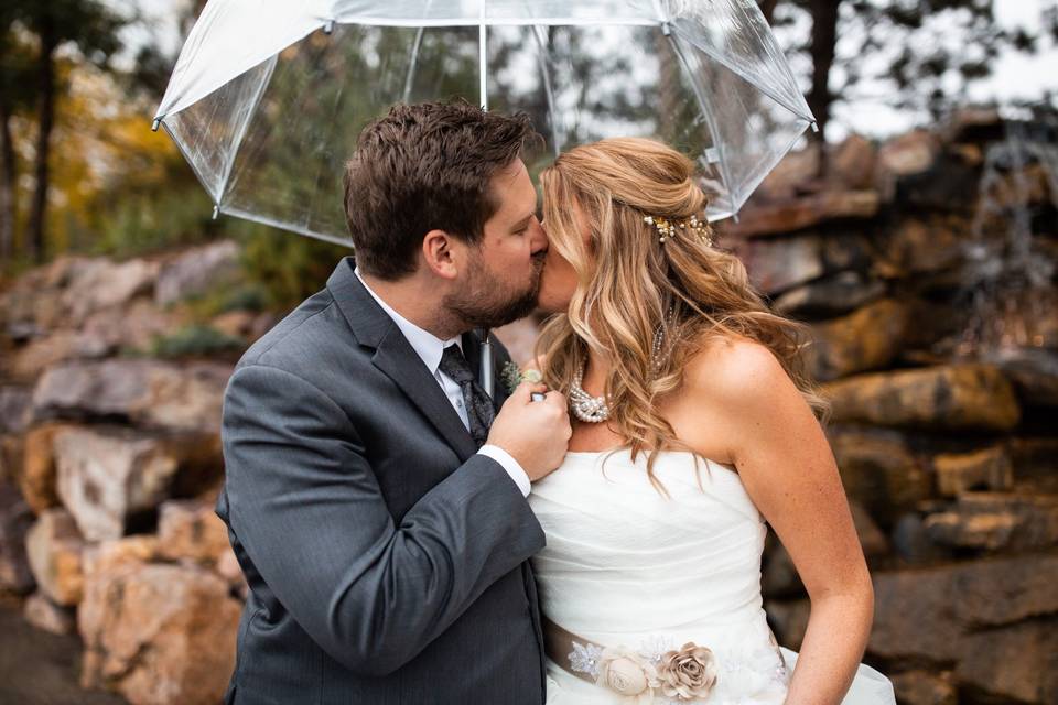 Kiss under an umbrella