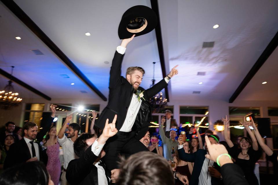 Groom on shoulders