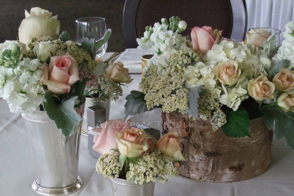 Reception #centerpieces utilized groups of #silver colored julip cups in various sizes, and #birch containers filled with #hydrangea, #roses, #cottage yarrow and #dusty miller.