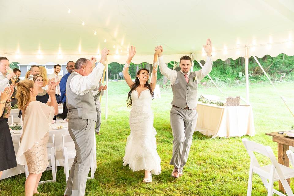 Bride and Groom Entering Tent