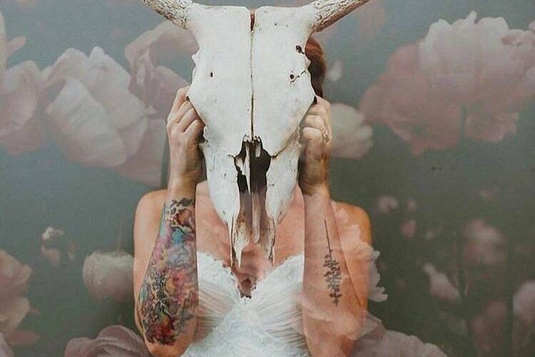 Bride holding animal skull
