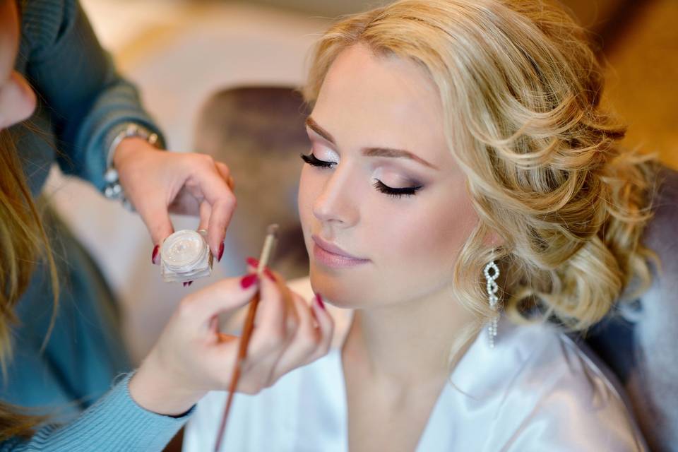 Bride getting makeup done