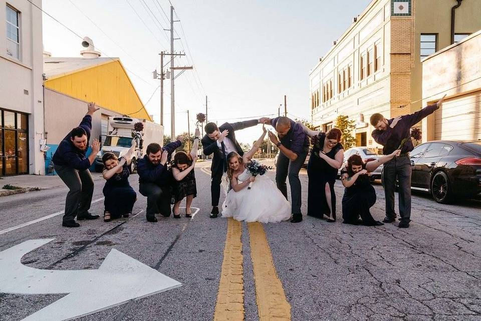 Newlyweds and their guests dabbing
