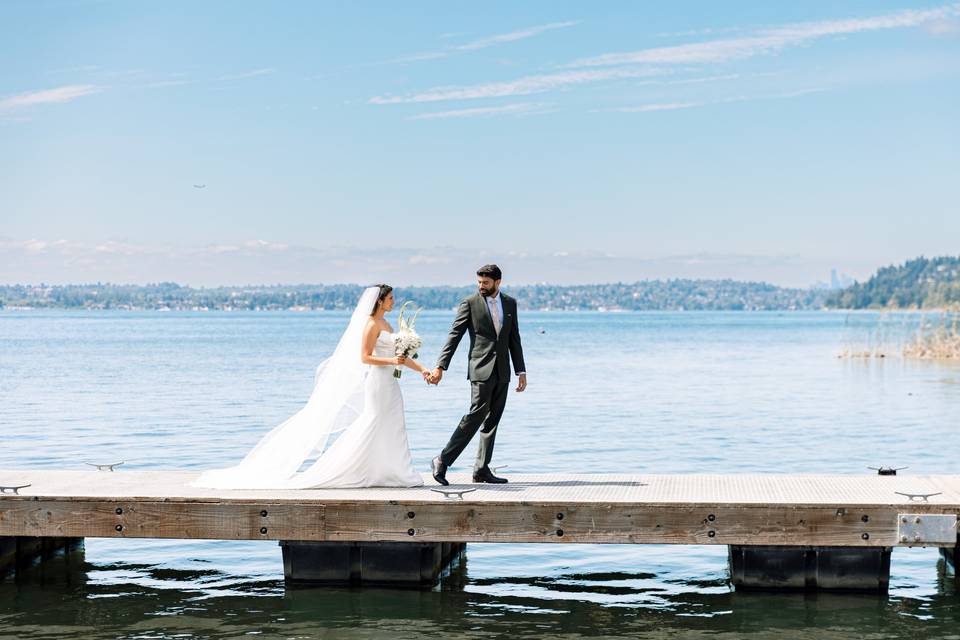 Bride and groom on dock.