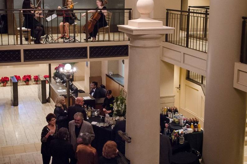 Musicians playing from the second floor