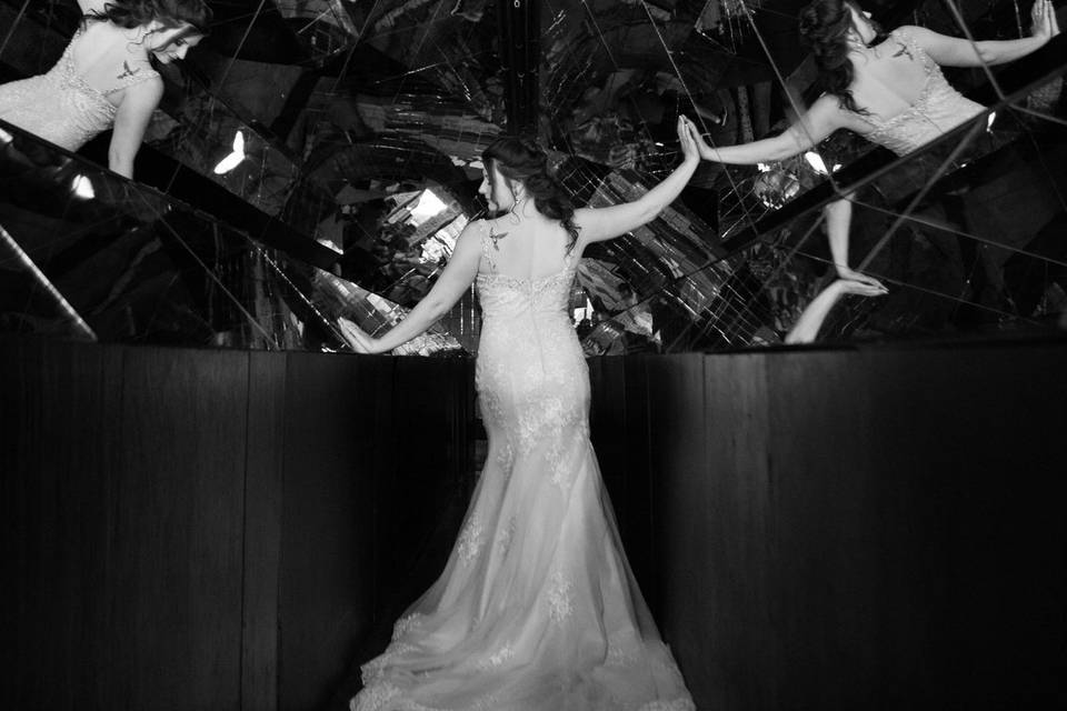 Bride posing with intricate mirror backdrop