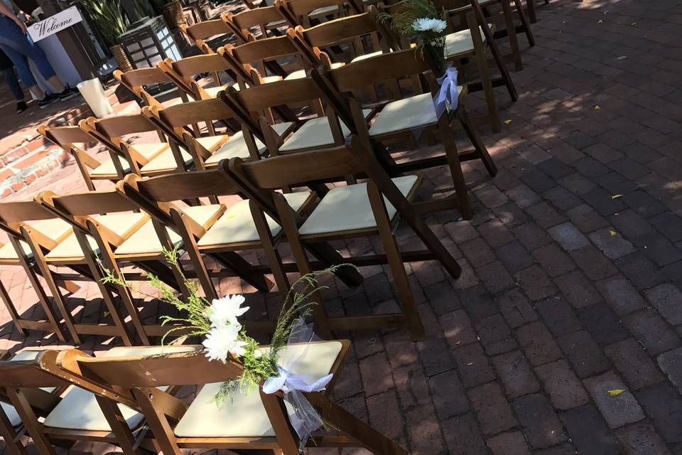 Ceremony simplicity and beauty with these brown folding chairs