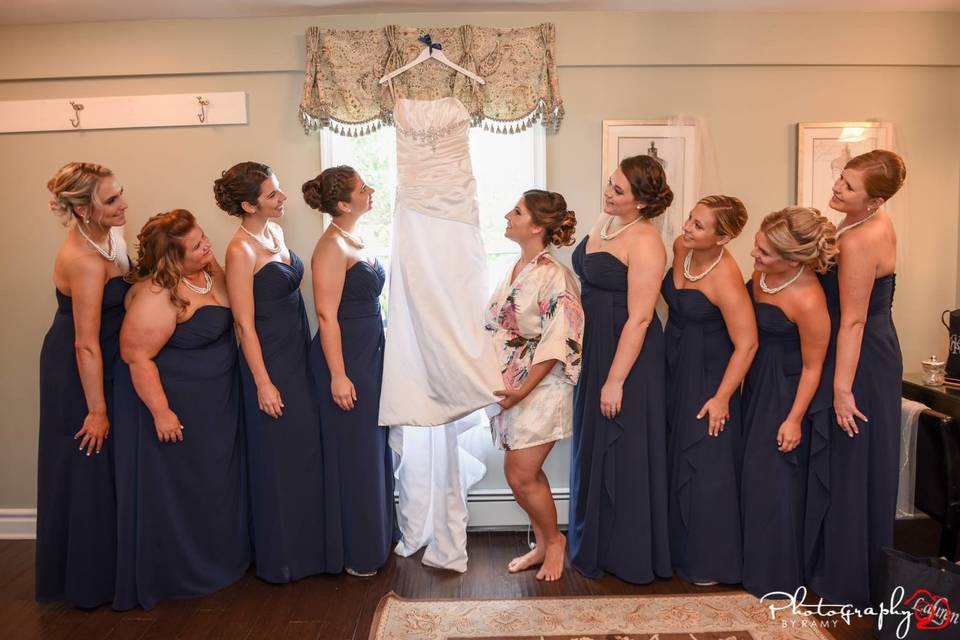 Ladies looking at the bride's dress