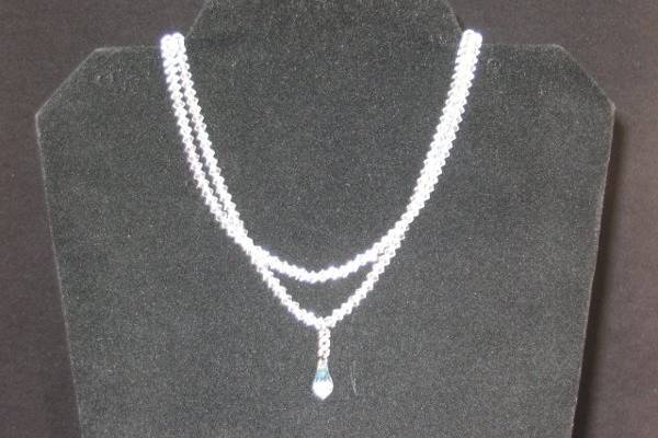 Classic double strand crystal necklace custom made to fit any bride perfectly.
Crystal tear drop accent set to hang just right on any dress.
Also available in single and triple strand.  Bracelets and earrings to match.