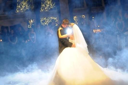 Newlyweds dancing on clouds