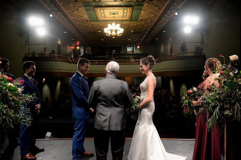 Wedding ceremony in the Historic Theatre of the Pella Opera House | Photo by: Digital Galleria Designs