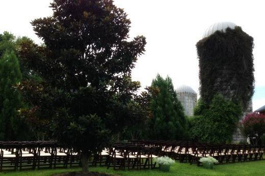 Outdoor wedding ceremony using Walnut wood folding chairs