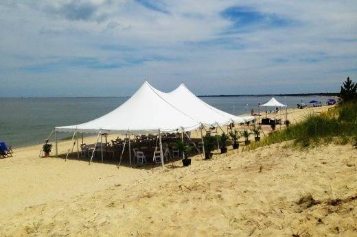 Outdoor, Beach wedding reception with small frame tent, cocktail tables and white Chinese lanterns