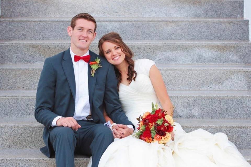 Happy couple sitting on steps
