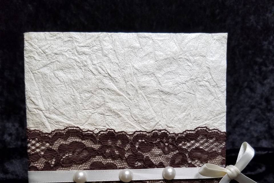 Handmade paper bi-fold with beautiful brown lace and petite ivory ribbon and pearls.