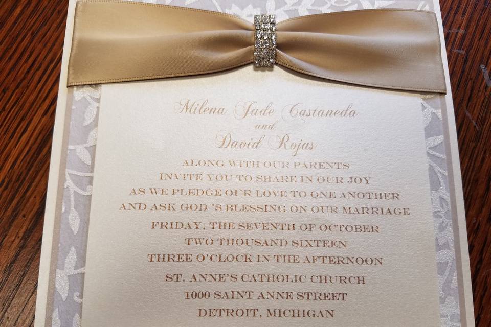 Square flat invite with handmade papers and lovely satin ribbon and buckle.  Classic beauty.