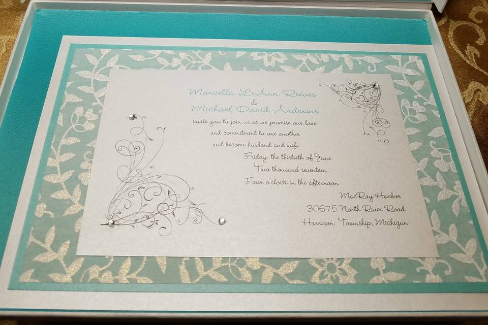 Love turquoise colors for this invite in a silver box...with handmade papers and bow.