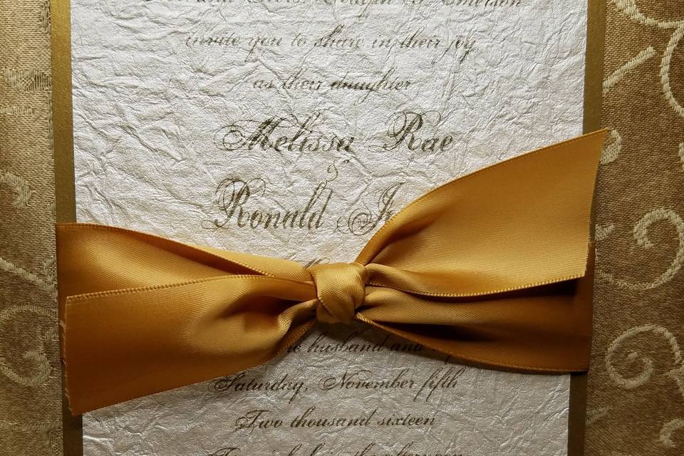 Simple and elegant 2 layer invite printed on a crinkled handmade paper.