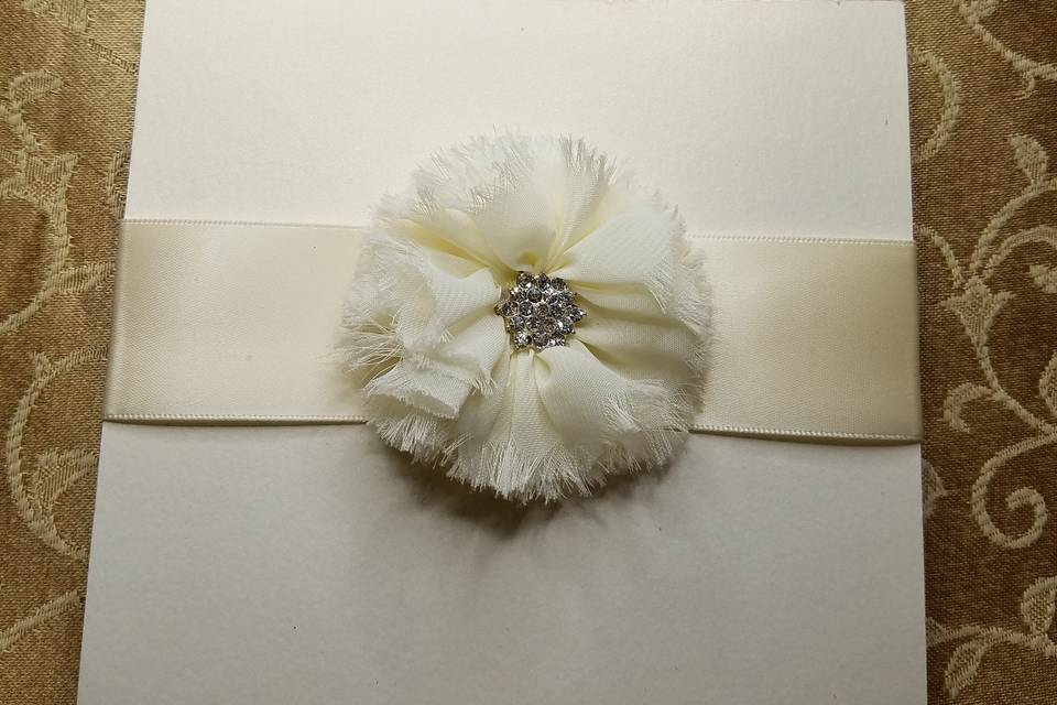 Ivory shimmer bi-fold with beautiful fringed chiffon bow and ivory silk ribbon
