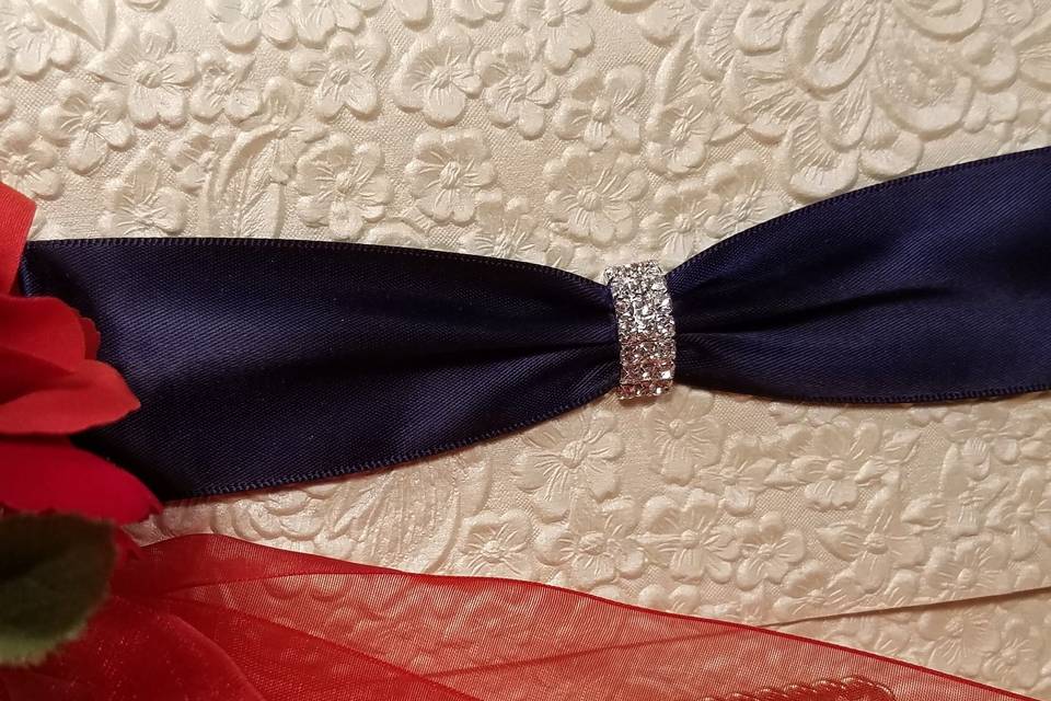 This embossed floral paper is gorgeous and handmade in India, with black satin ribbon and curved rhinestone buckl.em and is a tr-fold..