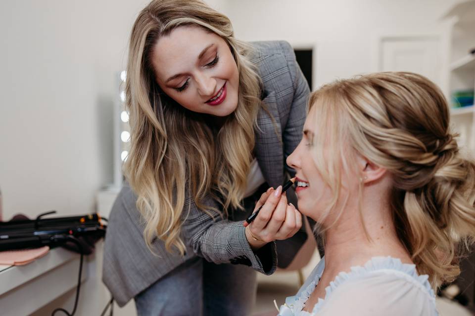 Katie applying lip liner