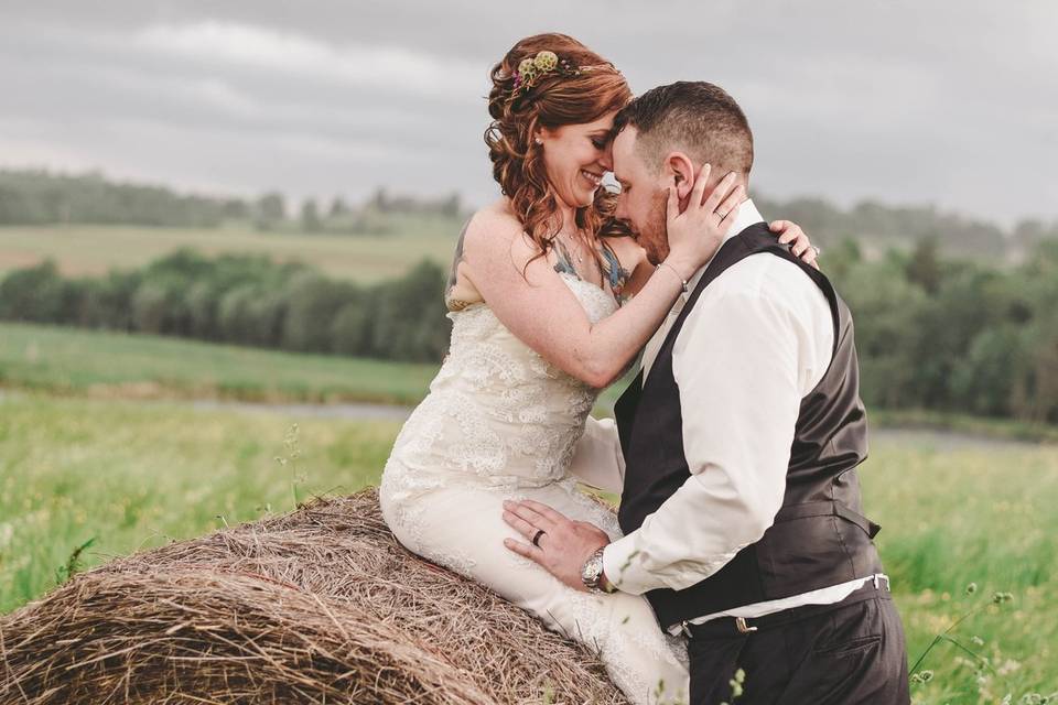 Couple by the hay bale