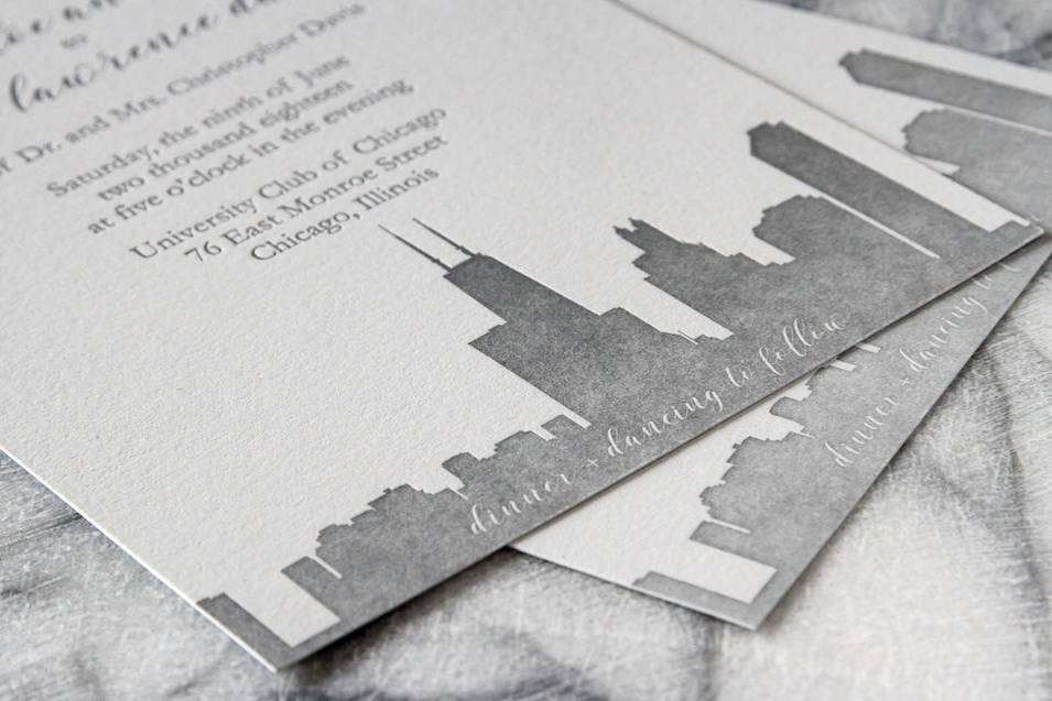 Letterpress wedding invitation suite printed with Chicago skyline.