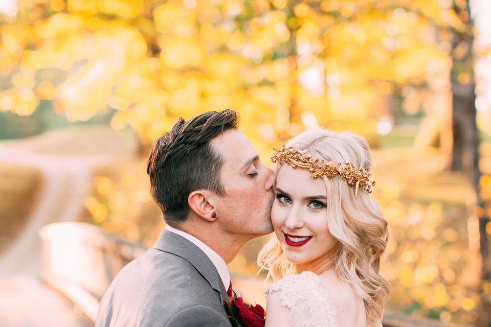 Blonde bride with gold crown and groom in grey suit at Kittanning Country Club