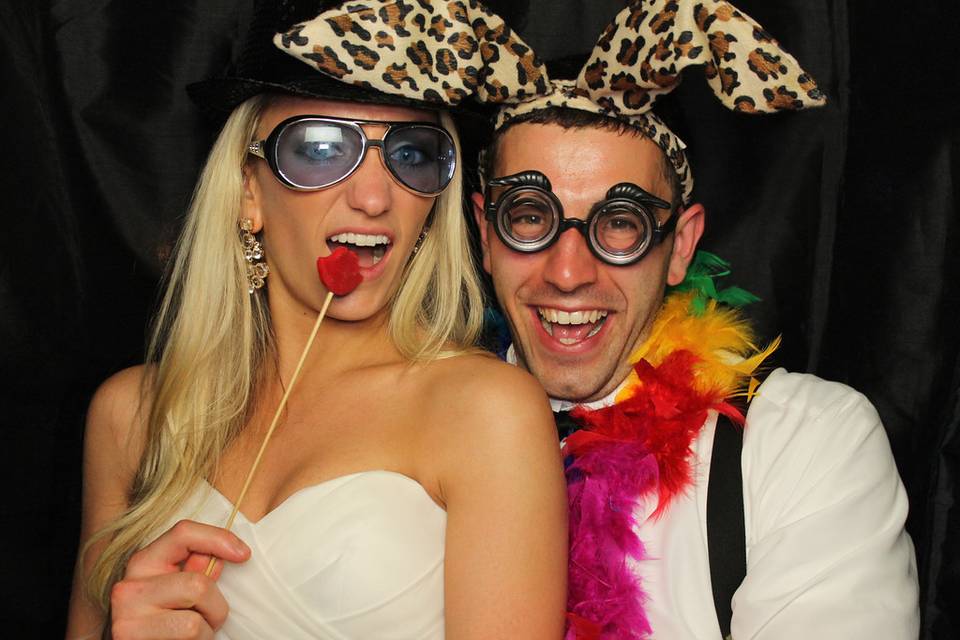 Newlyweds enjoying the photo booth