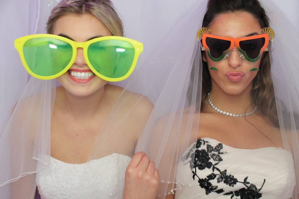 Newlyweds enjoying the photo booth